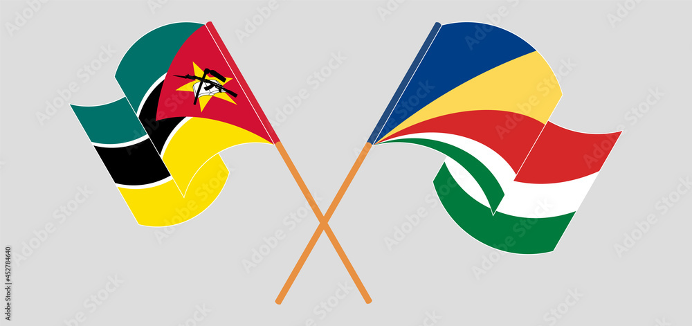 Crossed and waving flags of Mozambique and Seychelles Crossed and waving flags of Mozambique and Seychelles