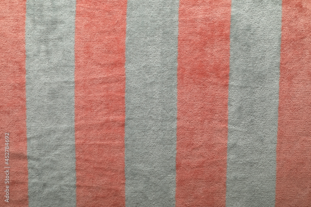 Striped beach towel as background, top view Striped beach towel as background, top view