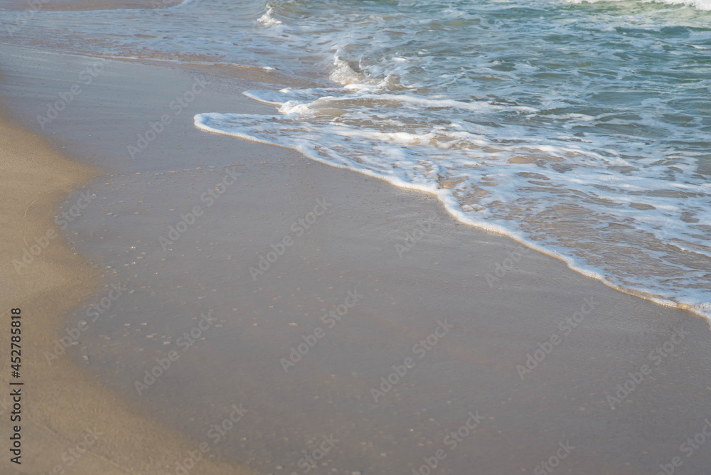 Sea or ocean tropical landscape view. Sea waves under the sun. Summer vacation and travel concept. Water wave surface. Sand beach. Sea or ocean tropical landscape view. Sea waves under the sun. Summer vacation and travel concept. Water wave surface. Sand beach.