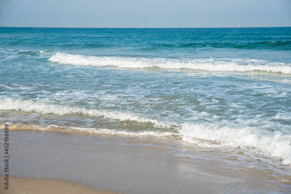 Sea or ocean tropical landscape view. Sea waves under the sun. Summer vacation and travel concept. Water wave surface. Sand beach. Sea or ocean tropical landscape view. Sea waves under the sun. Summer vacation and travel concept. Water wave surface. Sand beach.