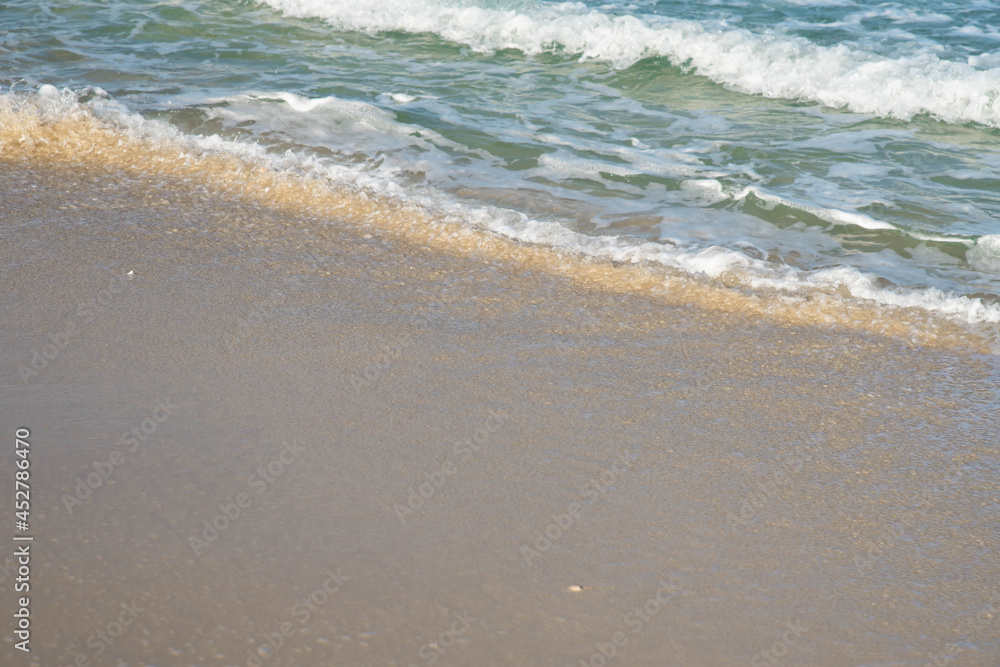 Sea or ocean tropical landscape view. Sea waves under the sun. Summer vacation and travel concept. Water wave surface. Sand beach. Sea or ocean tropical landscape view. Sea waves under the sun. Summer vacation and travel concept. Water wave surface. Sand beach.