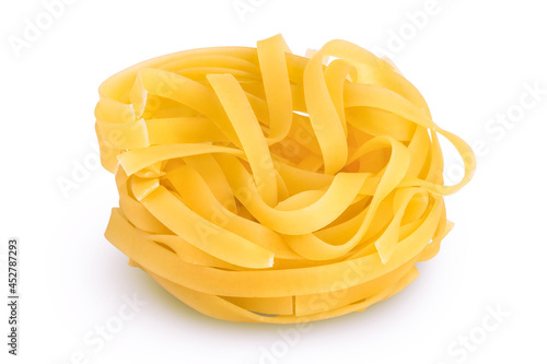 Raw tagliatelle pasta isolated on white background with clipping path and full depth of field