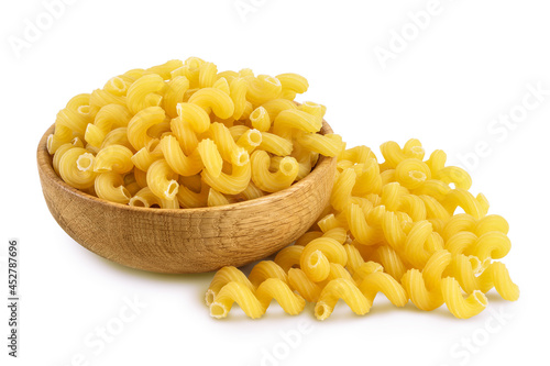 raw pasta cavatappi in wooden bowl isolated on white background with clipping path and full depth of field. photo