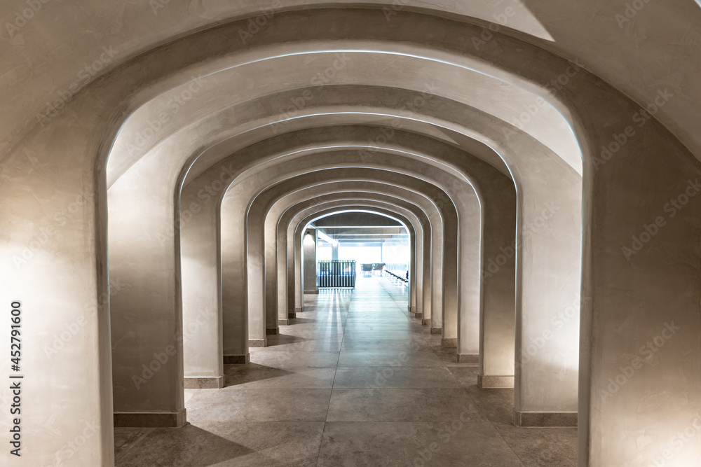 Interior of a long corridor with arches