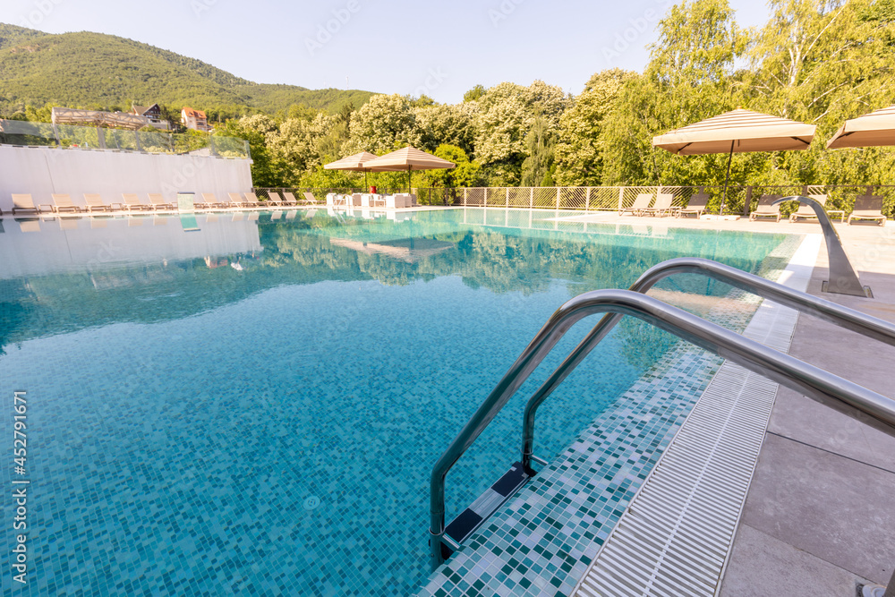 Outdoor swimming pool in a modern hotel Outdoor swimming pool in a modern hotel