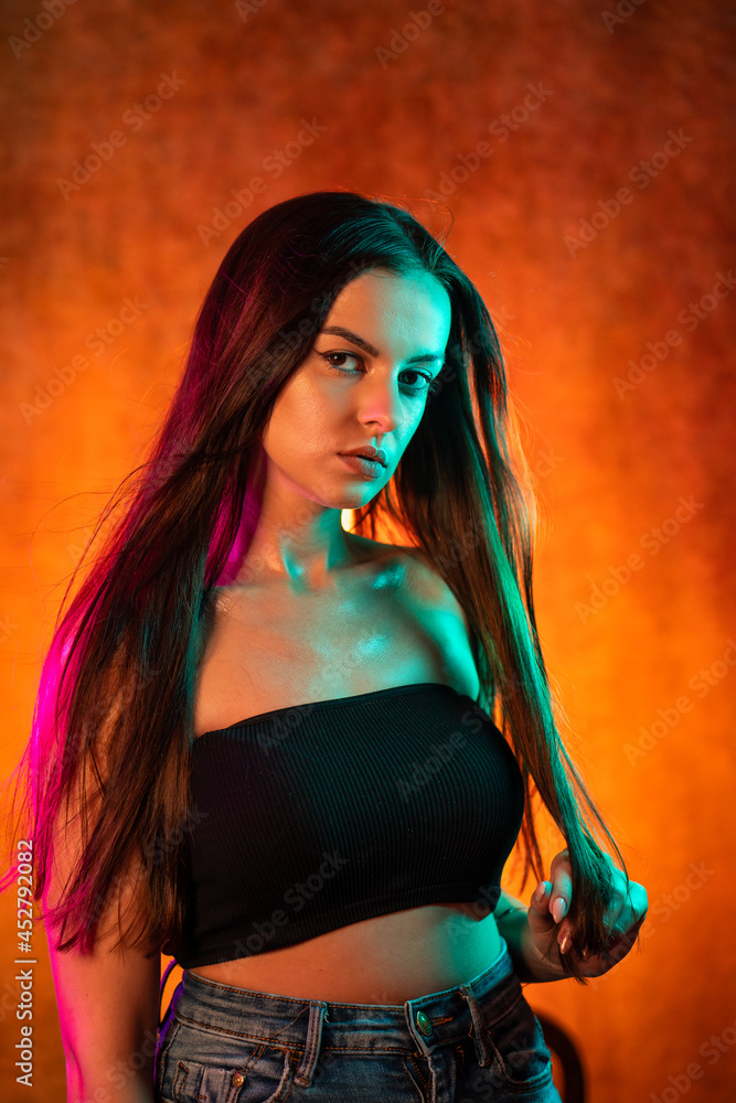 Portrait shot of a pretty young woman in RGB colors. Portrait shot of a pretty young woman in RGB colors.