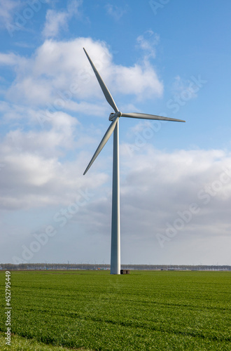 Windmill in grass field © Floyd