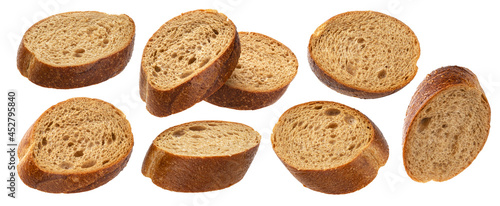 Foto Falling slices of rye bread isolated on white background
