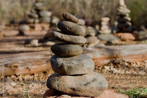 Photography Hikers stack rocks known as Cairns to leave a trail of direction or landmark of their path