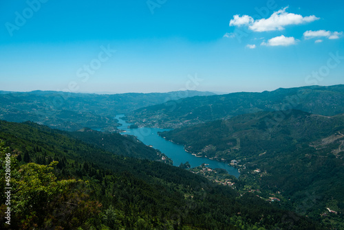 Pedra Bela viewpoint with a panorama of Cavado River from afar in the National Park of Peneda Geres, Portugal photo