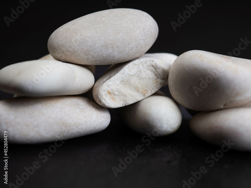 Stacked white stone on a black background