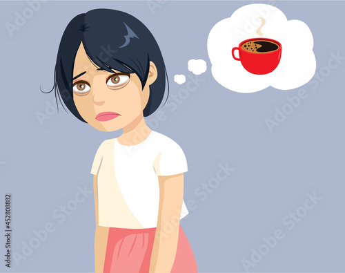 Young tired Asian woman thinking about drinking coffee to get energy