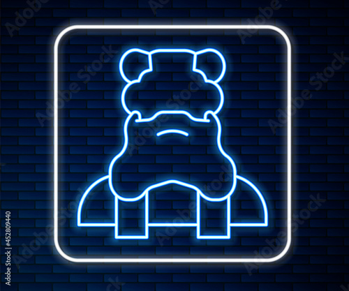 Glowing neon line Priest icon isolated on brick wall background. Vector
