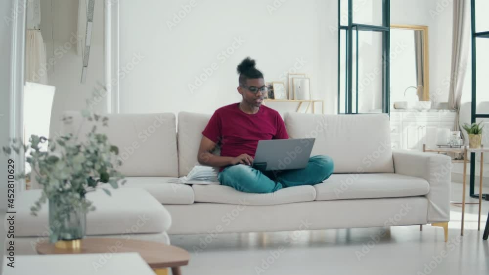 Young african-american man is studying online from home Young african-american man is studying online from home