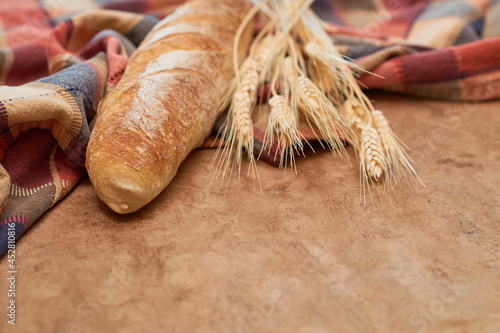 Homemade Sourdough Bread baguette on a rustic background. Vegan food Concept.