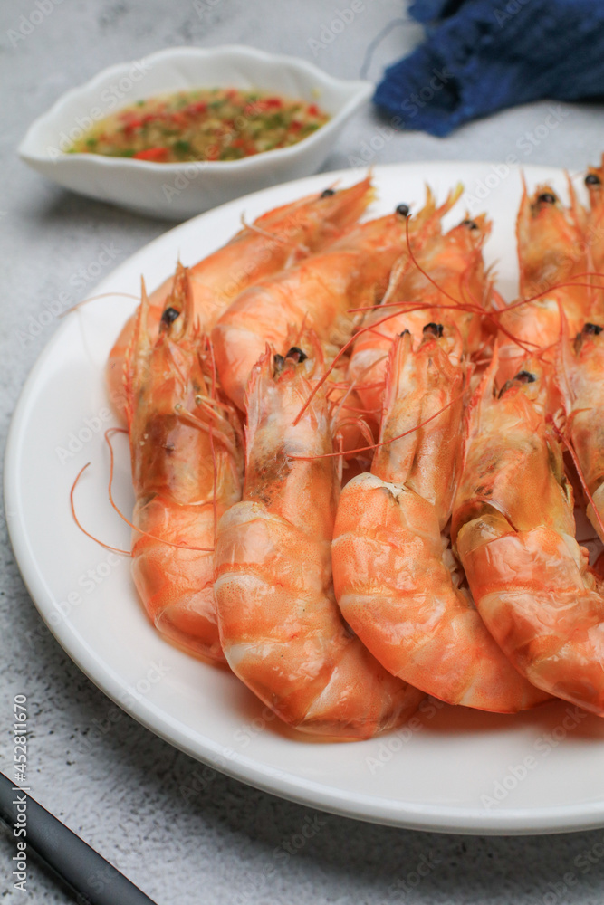 Fresh boiled big sea shrimps (prawns) with spicy seafood sauce and rice. Healthy food. Cooked steamer food served seafood. Fresh boiled big sea shrimps (prawns) with spicy seafood sauce and rice. Healthy food. Cooked steamer food served seafood.