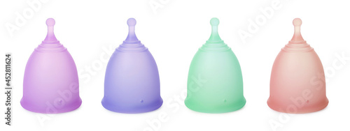 Set with different menstrual cups on white background. Banner design photo