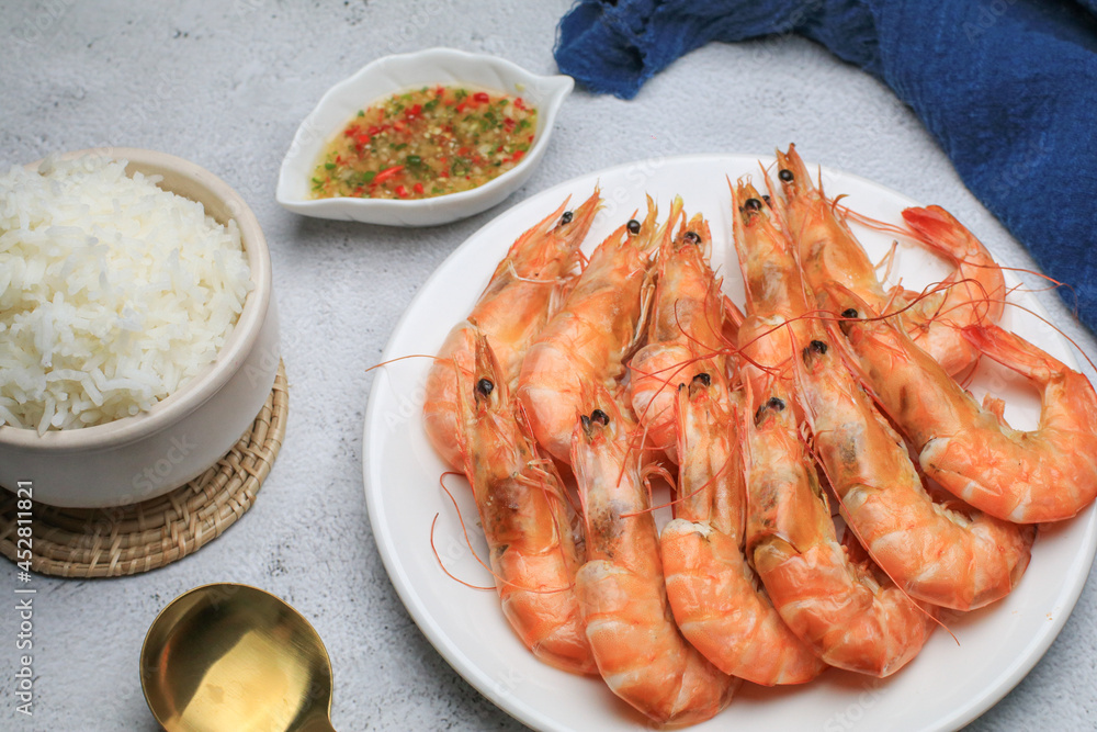 Fresh boiled big sea shrimps (prawns) with spicy seafood sauce and rice. Healthy food. Cooked steamer food served seafood. Fresh boiled big sea shrimps (prawns) with spicy seafood sauce and rice. Healthy food. Cooked steamer food served seafood.