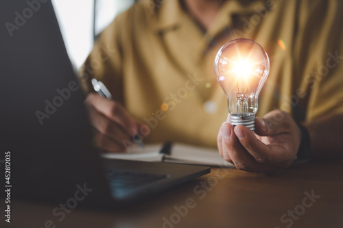 Innovation. Hands holding light bulb for Concept new idea concept with innovation and inspiration, innovative technology in science and communication concept,.