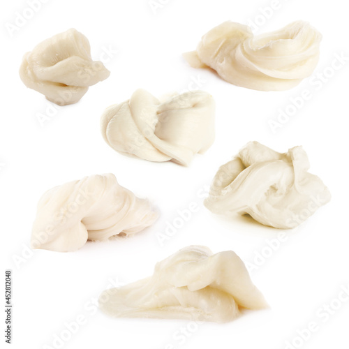 Set with used chewing gum on white background