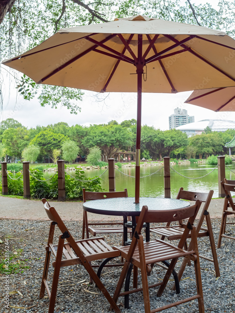 Table and chair by the lake in National Taiwan University