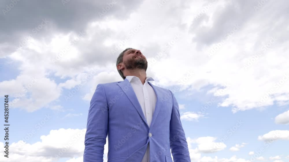 happy bearded man in jacket enjoying fresh air on sky background raising up hands, freedom happy bearded man in jacket enjoying fresh air on sky background raising up hands, freedom