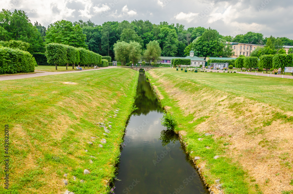 A long canal with water in the park.