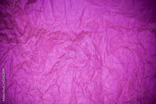 Textured paper purple background.
