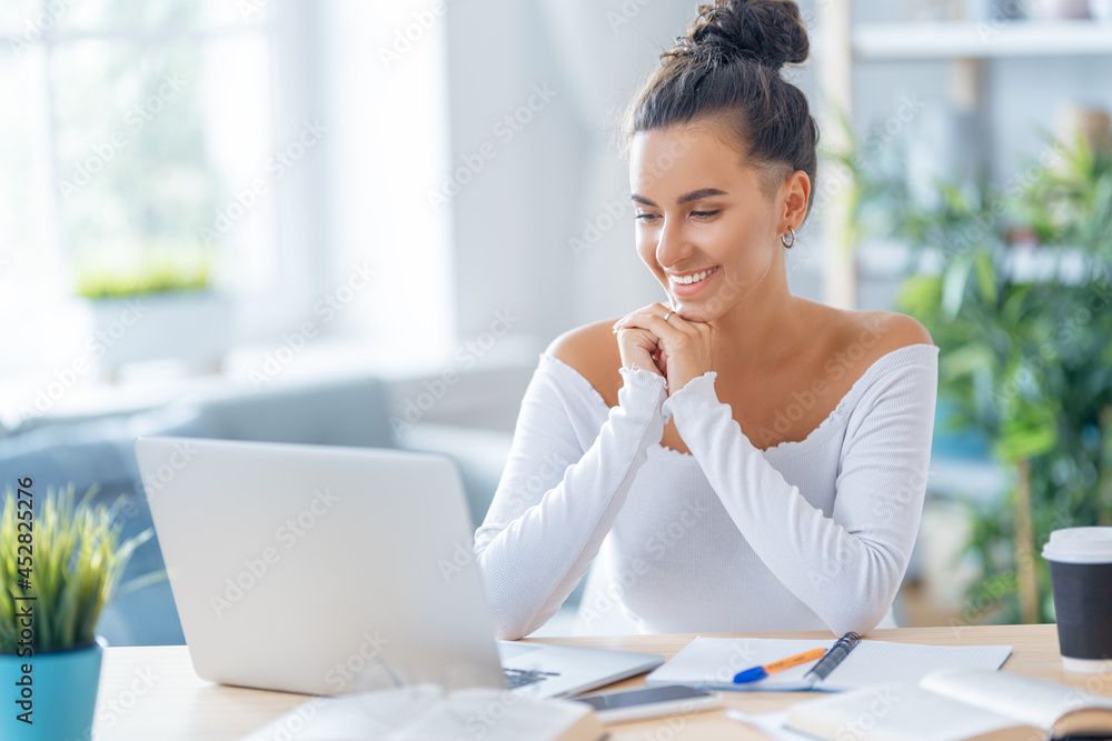 woman working on laptop at home. woman working on laptop at home.