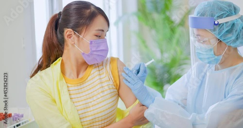 woman has inject vaccine photo