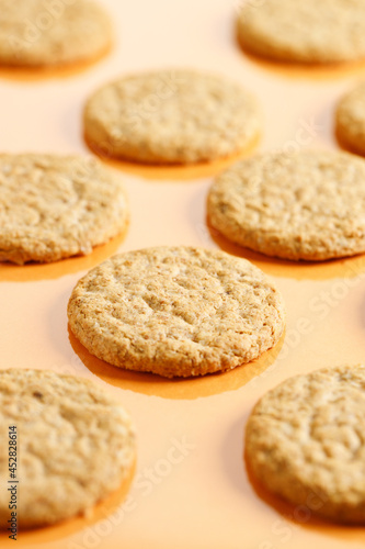 sweet cookies on orange color background.