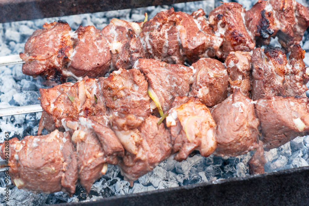 shish kebab on skewers is fried on the grill on coals shish kebab on skewers is fried on the grill on coals