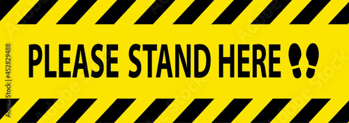 Social distancing concept for preventing coronavirus covid-19 with Wording Please Wait Here on Black tape sign border Yellow background