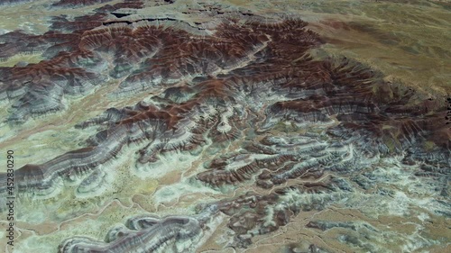 Cinematic aerial shot of colorful strata of Painted Desert in Arizona photo