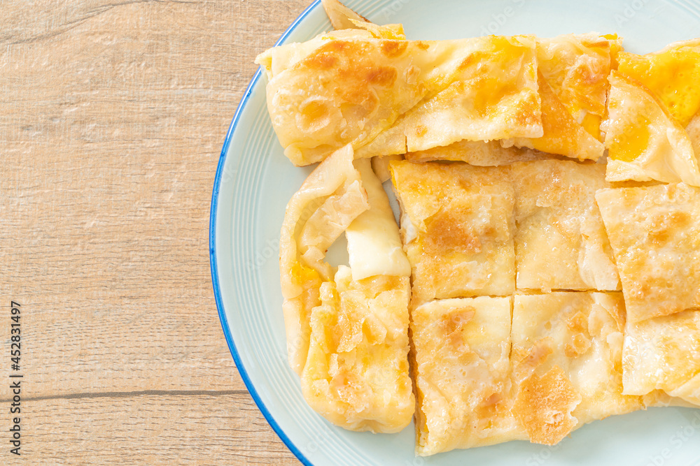 Milk And Roti roti with egg and sweetened condensed milk Stock Photo | Adobe Stock