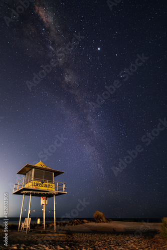 Gold Coast lifeguard tower at night with the milkyway in the sky over Currumbin Rock