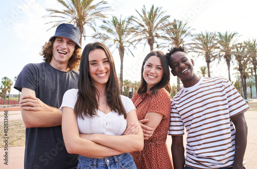 Portrait of young handsome interracial erasmus students. Group of happy students looking at the camera. photo