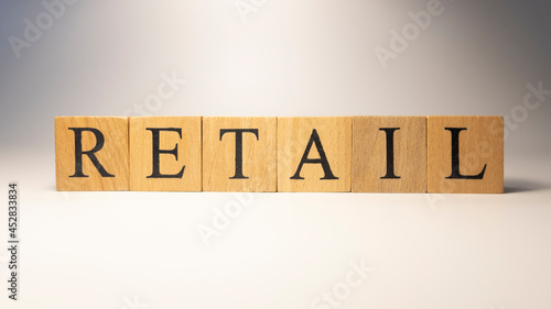 Retail word crafted from wooden cubes. Shopping and economy