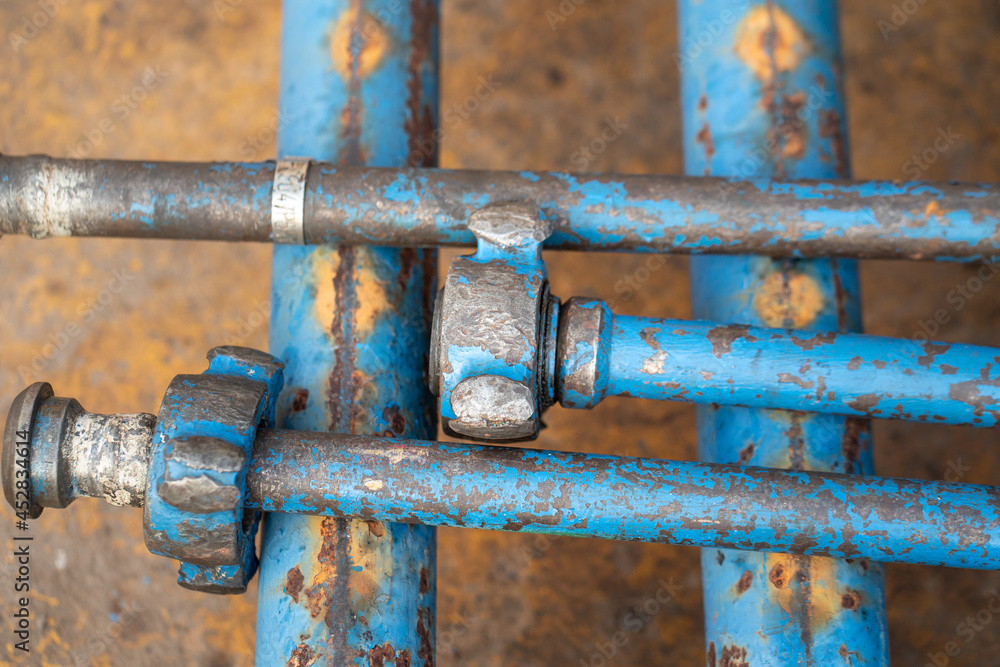 Heavy duty pipeline part with hammer union for connection, normally it using as fluid flowing transfer temporary line in refinery plant. Industrial equipment object. Selective focus. Heavy duty pipeline part with hammer union for connection, normally it using as fluid flowing transfer temporary line in refinery plant. Industrial equipment object. Selective focus.