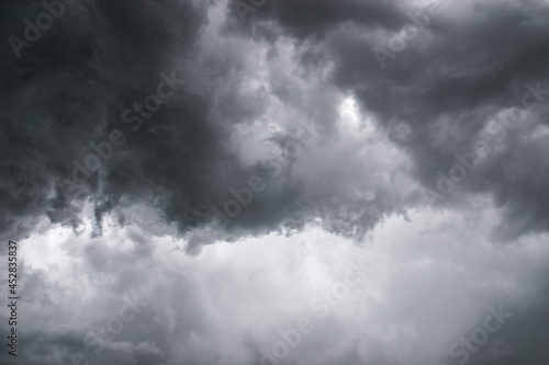 Dangerously menacing angry dark grey storm clouds