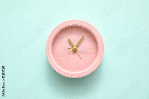 Alarm clock on color backgr...
