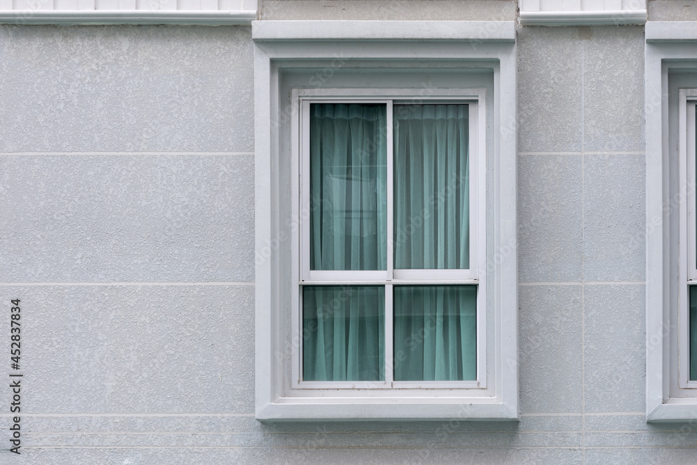 Modern new residential building windows with curtain uv protection inside. outdoor view.