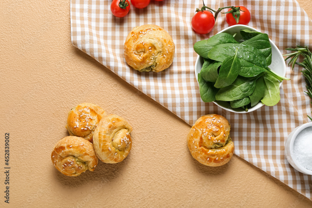 Puff pastry stuffed with spinach and vegetables on color background Puff pastry stuffed with spinach and vegetables on color background