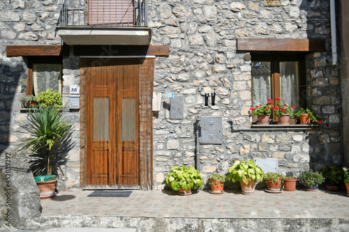 Facade of an old house in the historic center of Castelsaraceno, an old town in the Basilicata region, Italy. photo