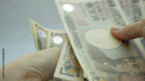 Female hands counting japan money banknotes. photo