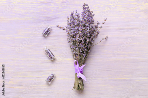 Fototapeta Naklejka Na Ścianę i Meble -  Composition with lavender flowers on light wooden background
