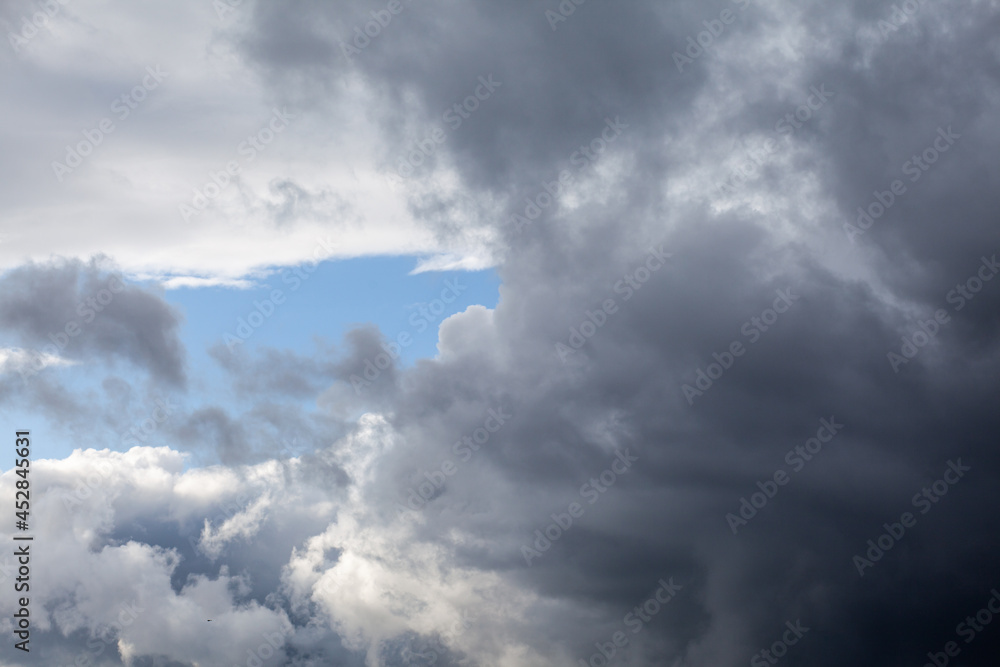 Dramatic sky with grey clouds over the city before the storm. Weather before or after a storm. Dramatic sky with grey clouds over the city before the storm. Weather before or after a storm.