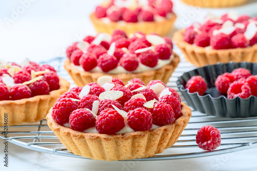 Tartlets with custard and raspberries.