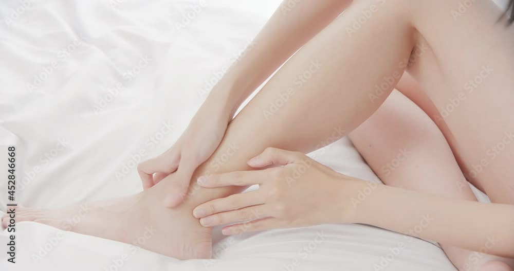 woman scratching her leg woman scratching her leg
