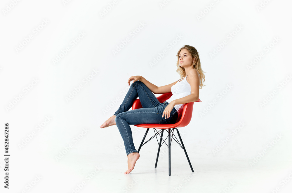 woman sitting on red chairs posing glamor fashion lifestyle woman sitting on red chairs posing glamor fashion lifestyle